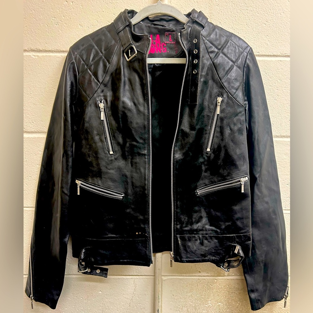 Woman’s vintage black leather Billabong zippered jacket size large